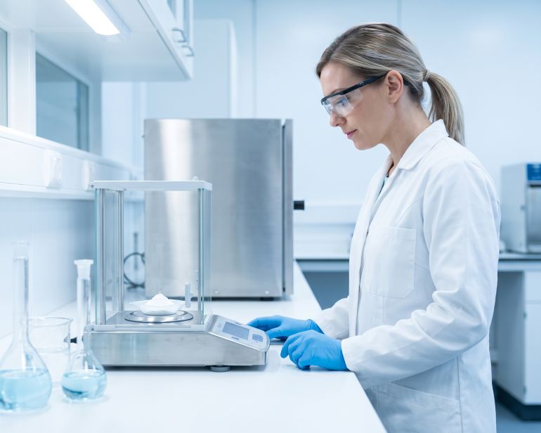Scientist testing powder purity in a laboratory