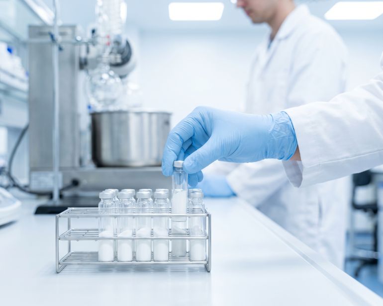 Scientist testing powder samples in a laboratory